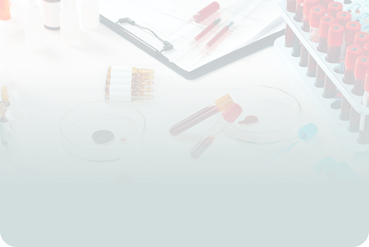 A close-up of test tubes, various pieces of laboratory equipment, and a pad with a document, suggesting a laboratory setting.